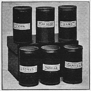 Montessori sound cylinders (sound boxes), six labeled cylinders, Fig. 26 in Dr. Montessori's Own Handbook, 1914