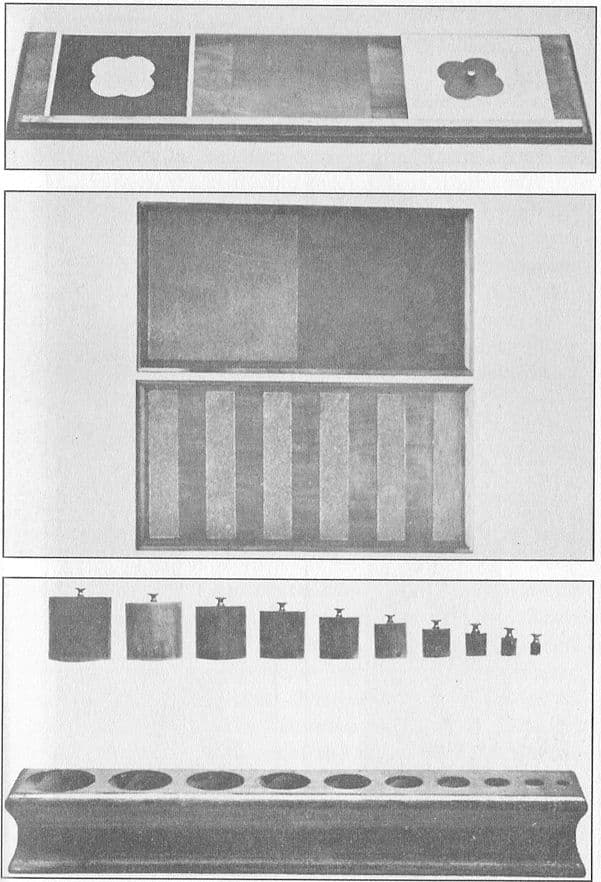 Montessori metal inset on a drawing table, above tablets partly covered with sandpaper, The Montessori Method, 1912